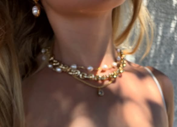 Person wearing a white lace dress with a blurred background