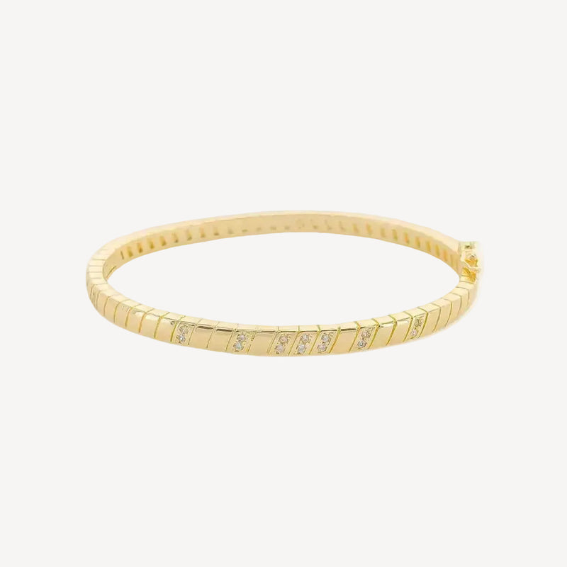 Gold bracelet with small diamonds on a white background