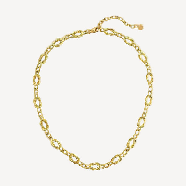 Gold chain necklace on a white background