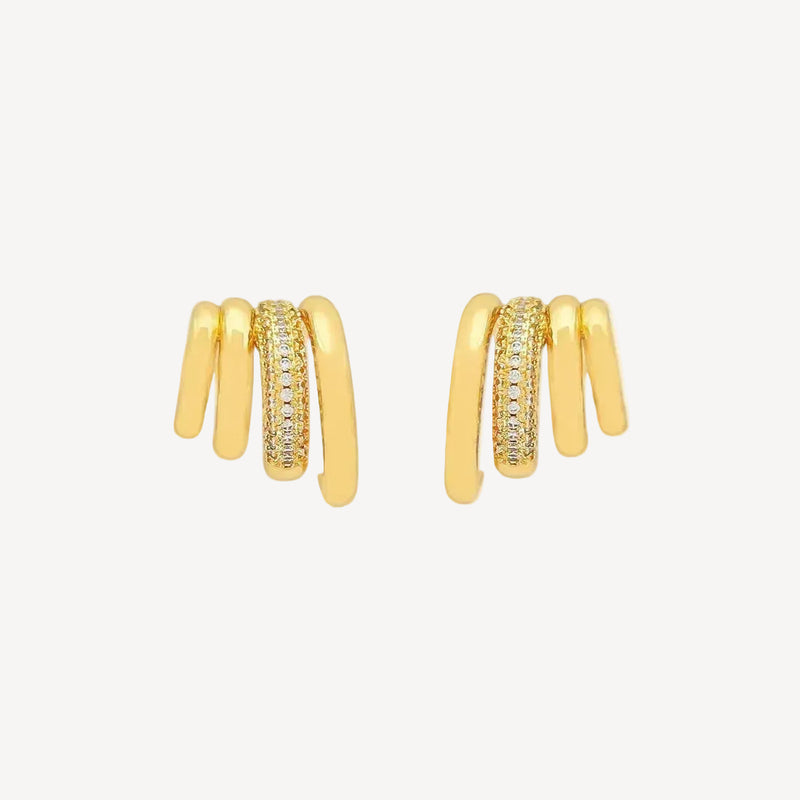 Gold hoop earrings with embedded stones on a white background