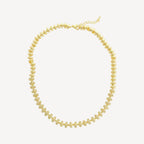 Gold necklace on a white background