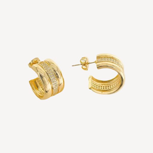 Gold hoop earrings on a white background