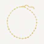 Gold beaded necklace on a white background