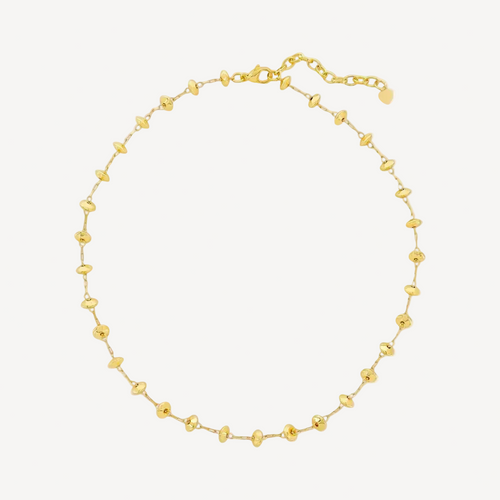 Gold beaded necklace on a white background